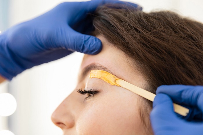 Waxing in mega beauty salon megabeautyltd.co.uk a well equipped beauty salon woman-getting-eyebrow-treatment