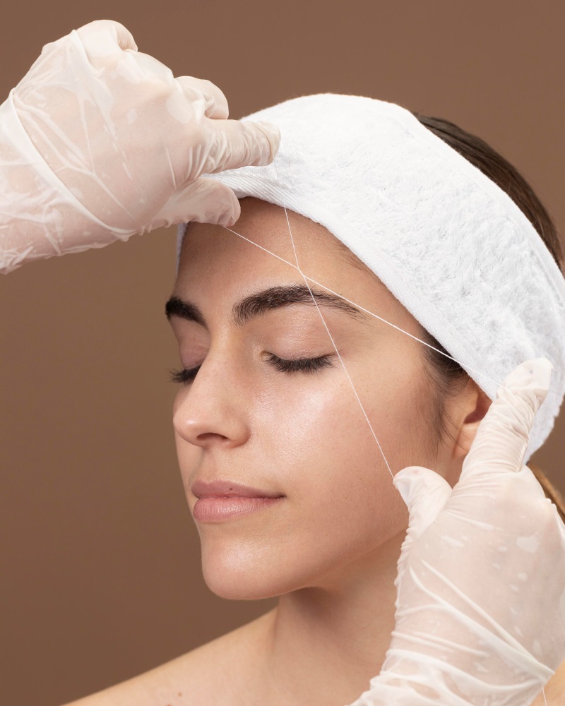 Threading in mega beauty salon megabeautyltd.co.uk a well equipped beauty salon close-up-young-woman-getting-eyebrow-treatment